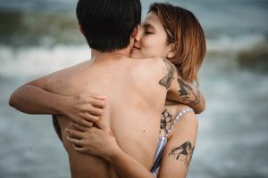 Couple Hugging near Water